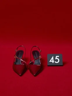 Wynn Patent Asymmetric-Strap Slingback Pumps